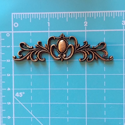 Пластикова прикраса Віньєтка під античне золото від E.В.A., 7х2см, 1 шт.