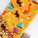 Ткань Оксфорд, Динозаврики на оранжевом фоне, 45х55 см